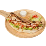BBQ Chicken Cheese Panuozzo BBQ chicken and cheese panuozzo sandwich on a wooden board