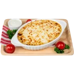 Classic Cheesy Potato Baked cheesy potato in a white dish with tomatoes
