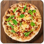 Potato Garlic & Bacon Crisps Pizza Potato, garlic and bacon pizza with basil